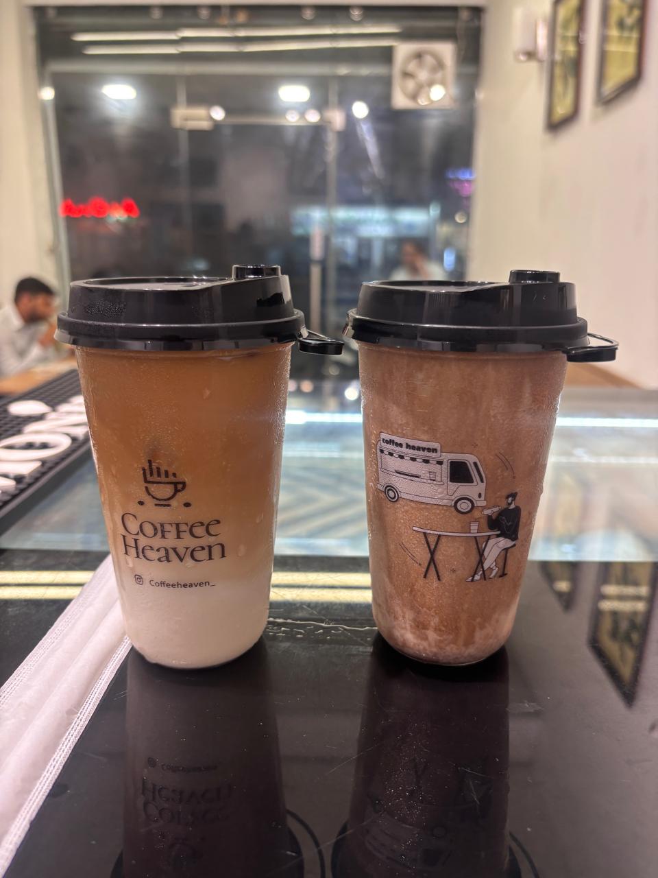 Two chilled Coffee Heaven frappes in takeaway cups